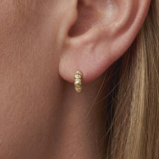video of 18ct gold plated beaded huggie hoop earrings with cubic zirconia pavé bands